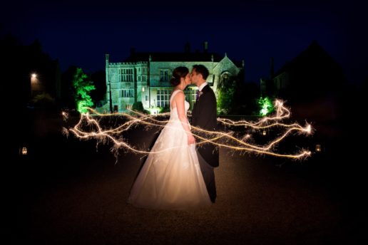 wedding couple inside the sparkle circle in front of brympton house