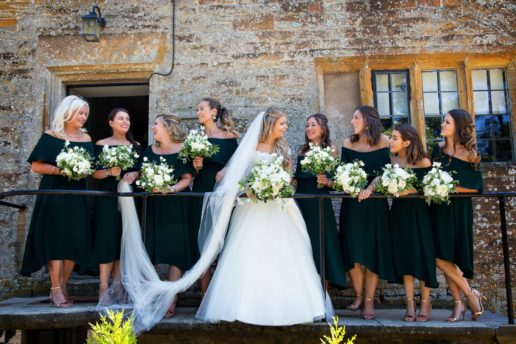 bride and their bridesmaids in front of bridal suite at brympton house