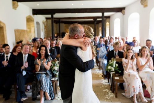 bride and groom hugging after the first kiss at coach house at brympton house