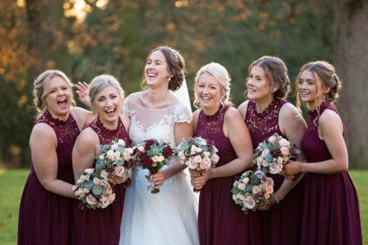 bride laughing with bridesmaids with Shilstone House