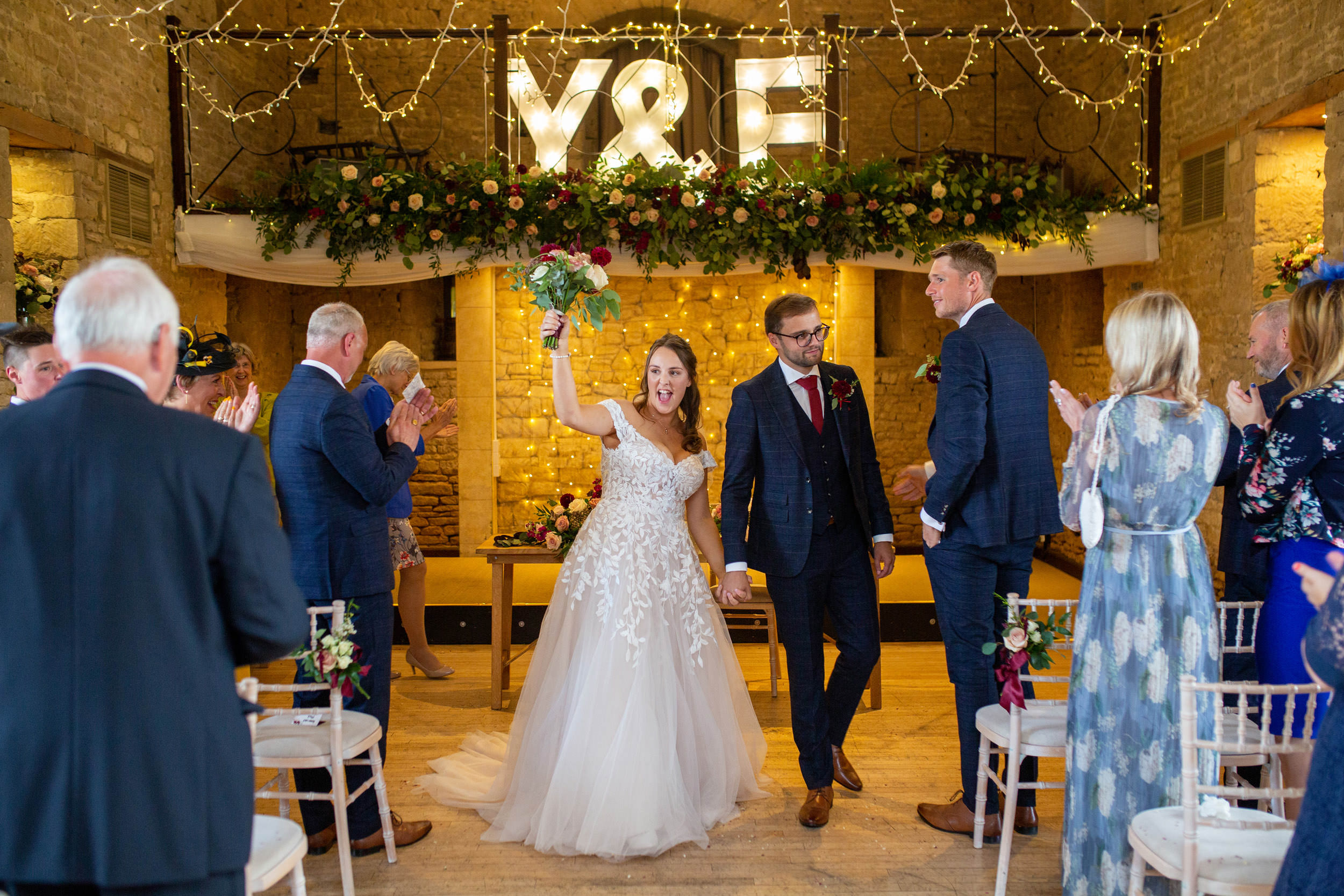 bride and groom just married at the great tythe barn in tetbury. The Great Tythe Barn Wedding Photography