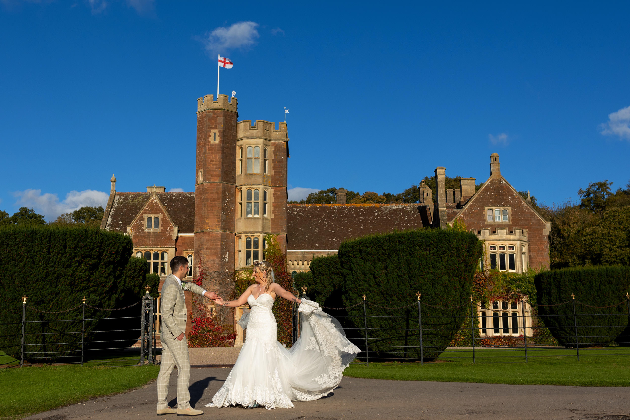 bride and groom dance in front of st audries park