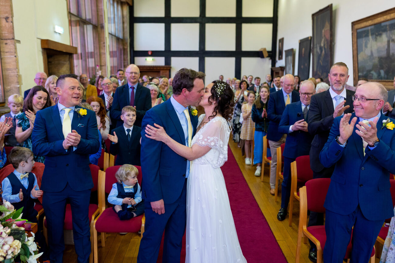 wedding couple kissing at civil ceremony at Tudor Hall at Taunton registry office