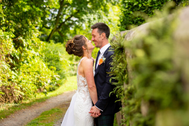 bride and groom having fun at ashley wood farm in wiltshire. ashley wood farm wedding photographer