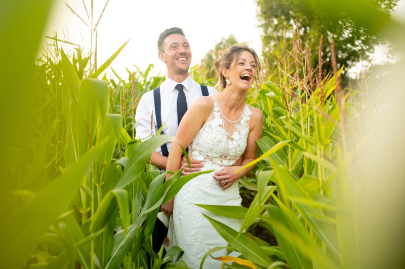 bride and groom having fun at ashley wood farm in wiltshire. ashley wood farm wedding photographer